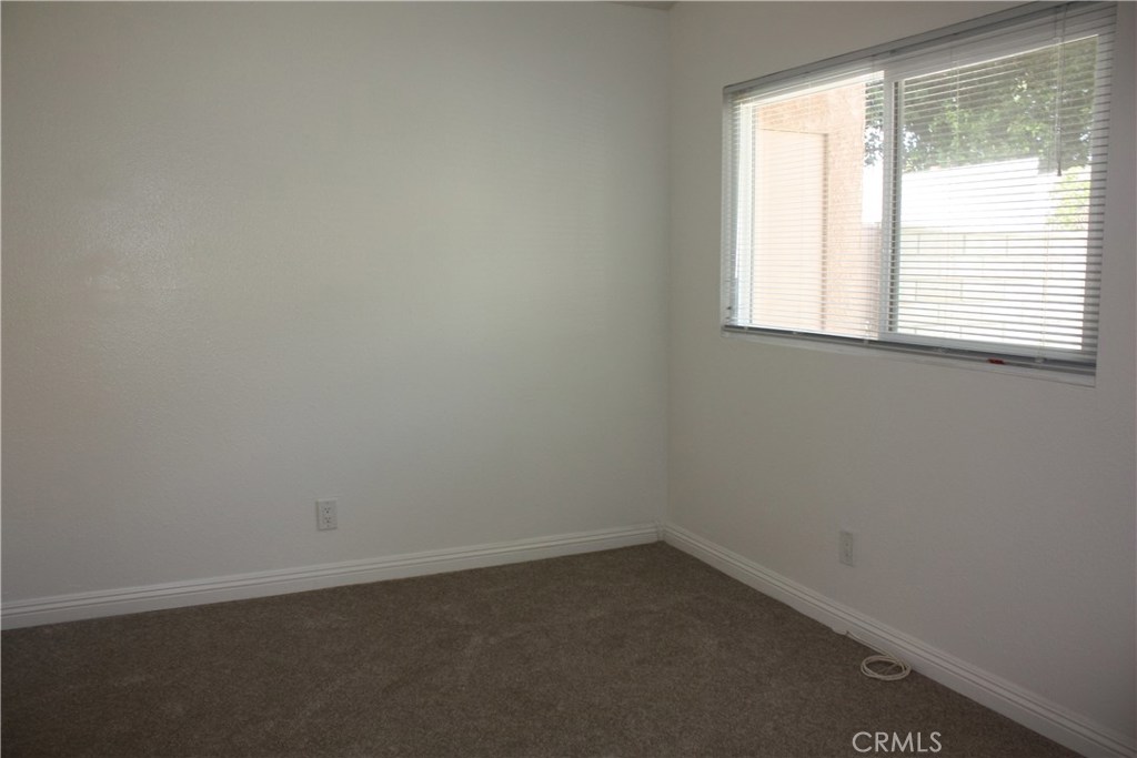 17041 A Lane, Unit B Huntington Beach, CA 92647 - Photo 10 of 16 an empty room with a window