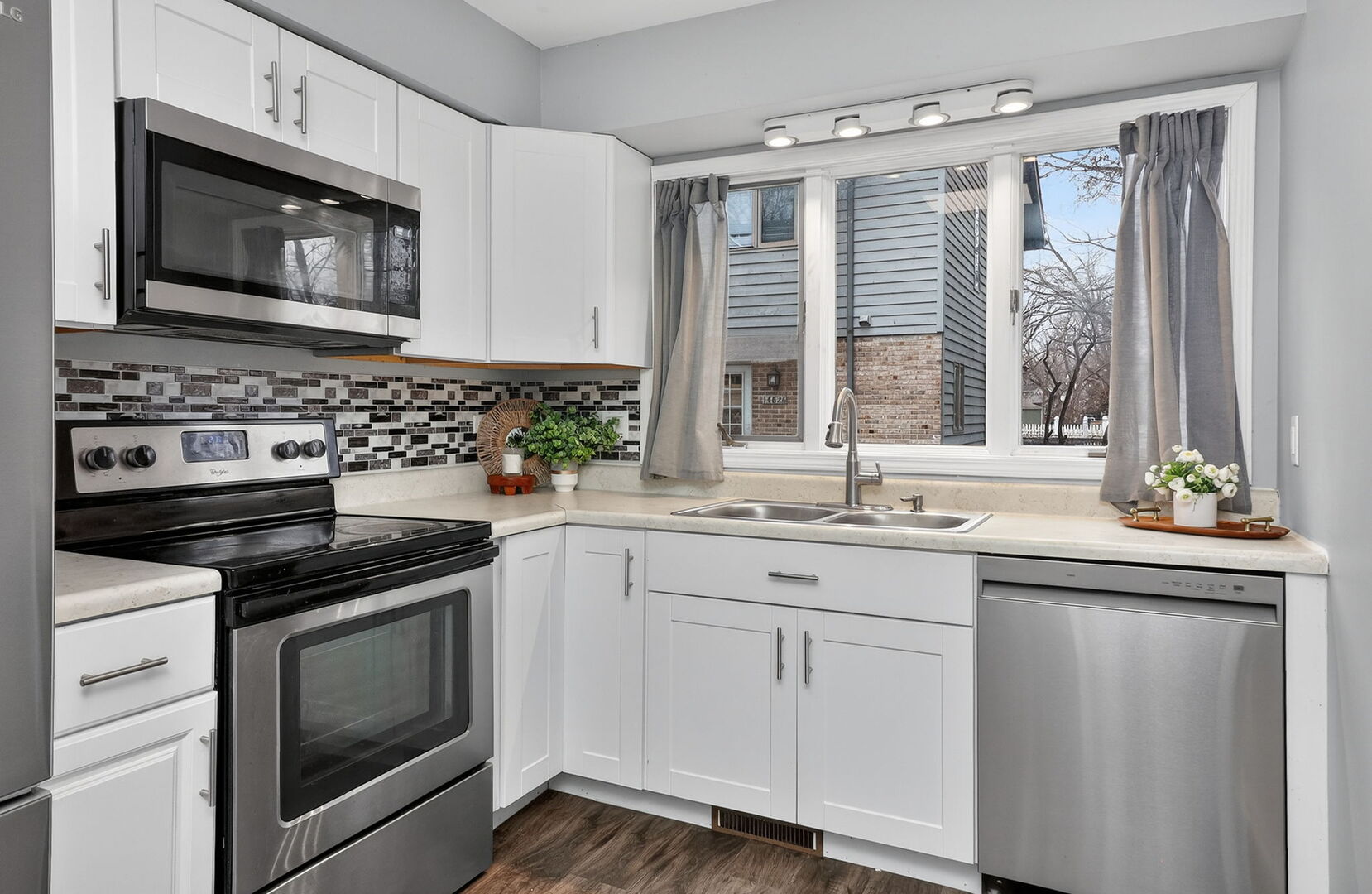 14816 South Penn Road Plainfield, IL 60544 - Photo 3 of 23 a kitchen with granite countertop white cabinets appliances and a sink