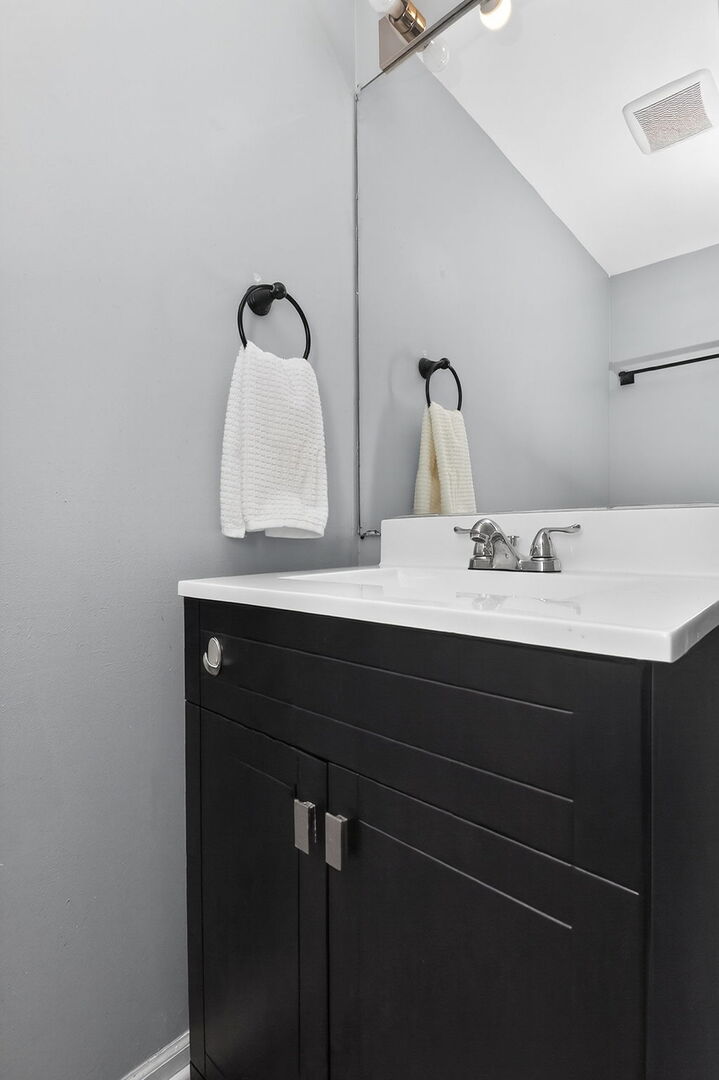 14816 South Penn Road Plainfield, IL 60544 - Photo 9 of 23 a bathroom with a sink vanity and a mirror