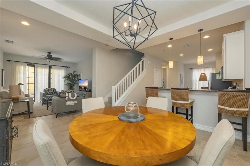 9105 Yuba Lane, Unit 7902 Naples, FL 34113 - Photo 6 of 25 a view of a dining room with furniture