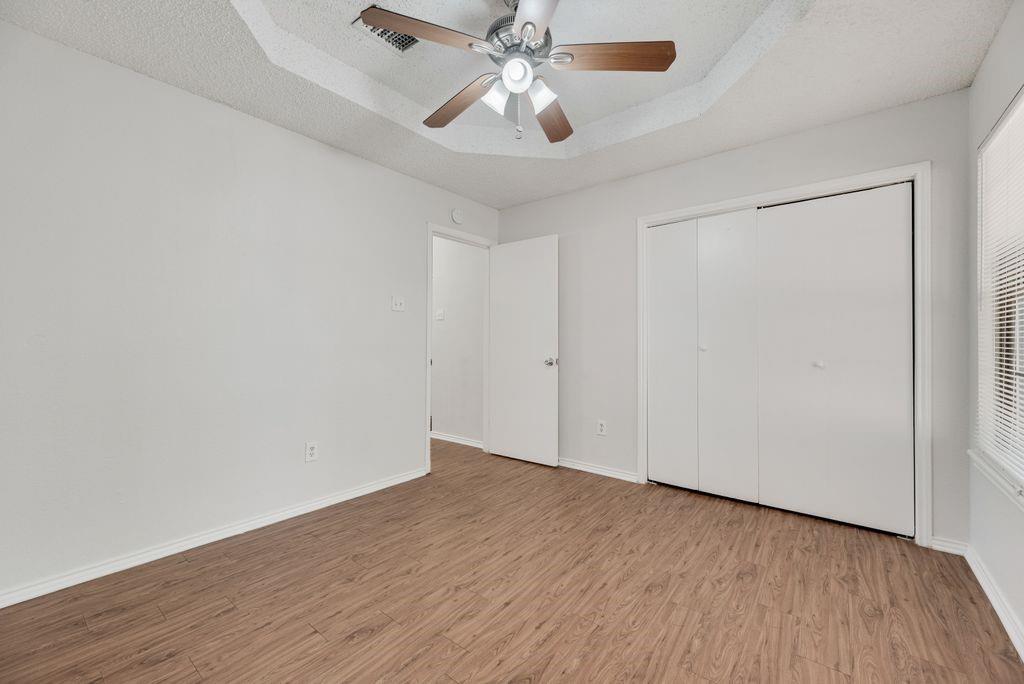 648 South Rogers Road, Unit 650 Irving, TX 75060 - Photo 12 of 21 a view of an empty room with wooden floor