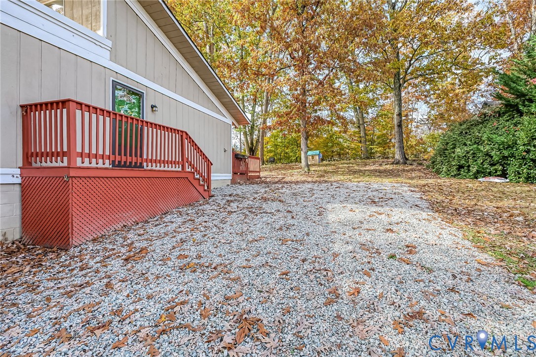 2009 Highland Drive Powhatan, VA 23139 - Photo 3 of 34 Side entrance with gravel driveway