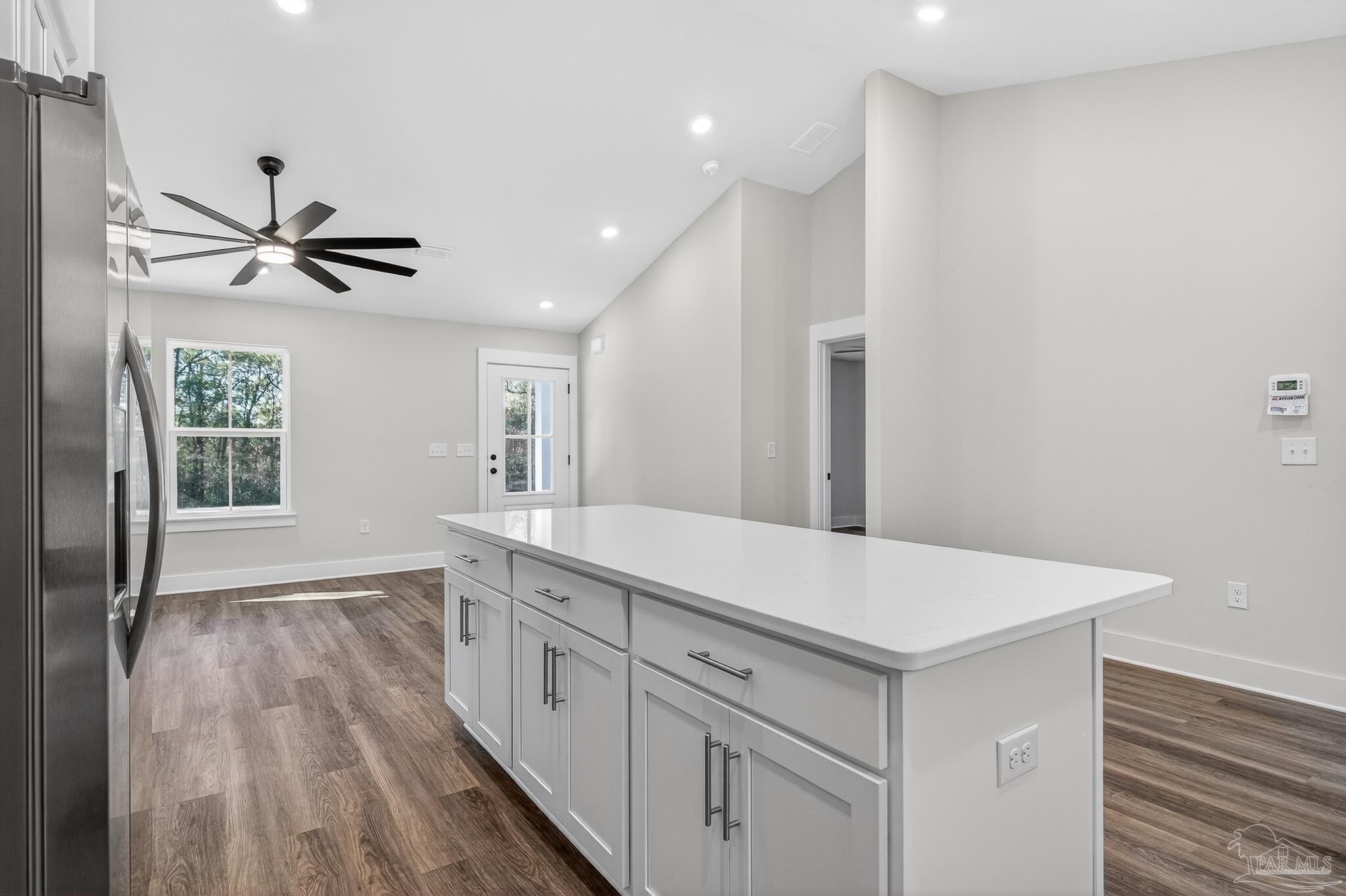 1056 Barth Road Molino, FL 32577 - Photo 14 of 46 a view of cabinets a sink wooden floor and a window