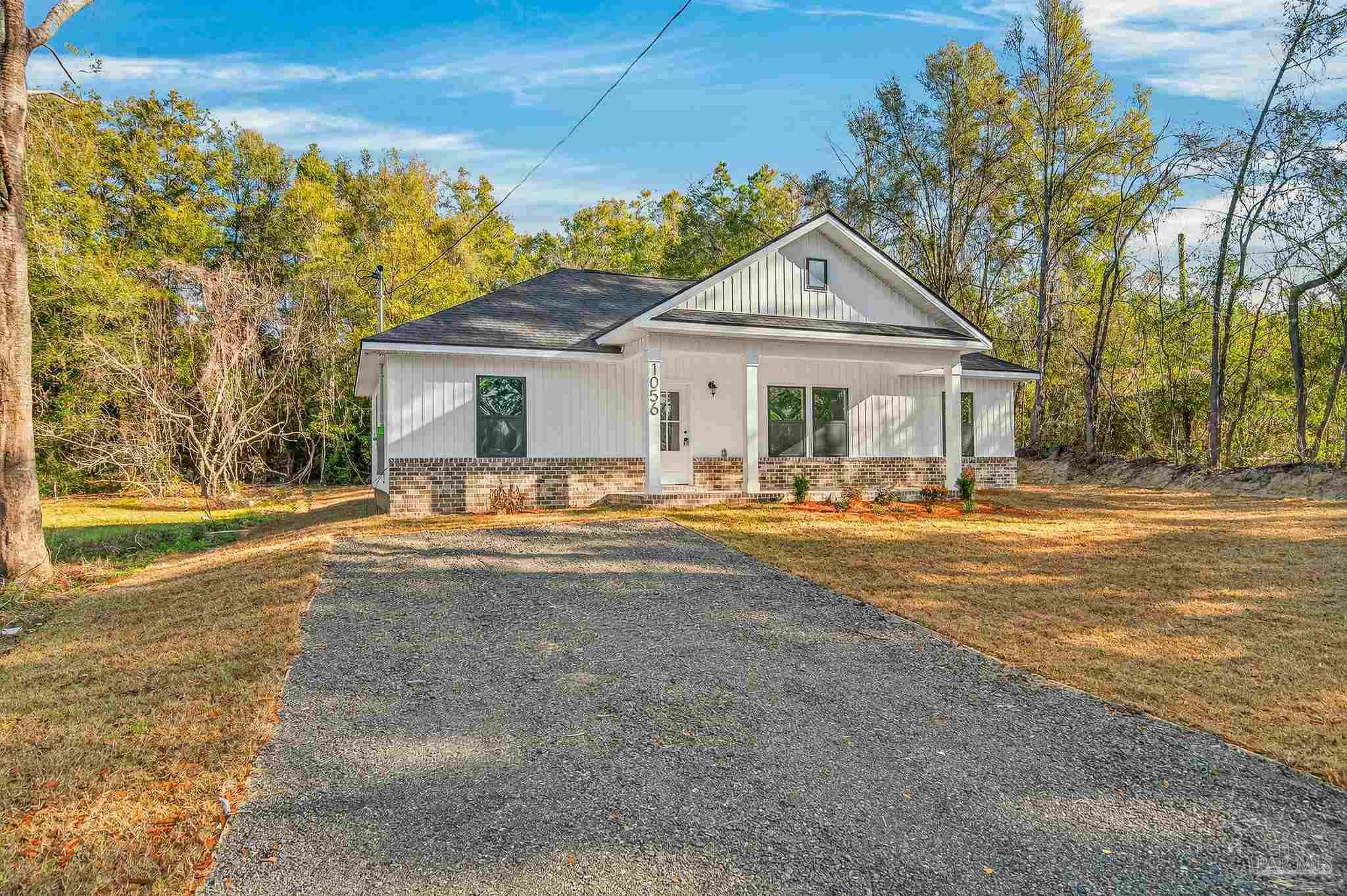 1056 Barth Road Molino, FL 32577 - Photo 18 of 46 a view of house with yard and swimming pool