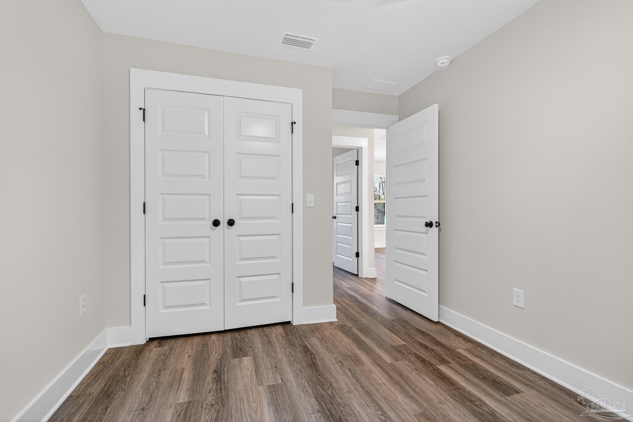 1056 Barth Road Molino, FL 32577 - Photo 27 of 46 wooden floor in an empty room