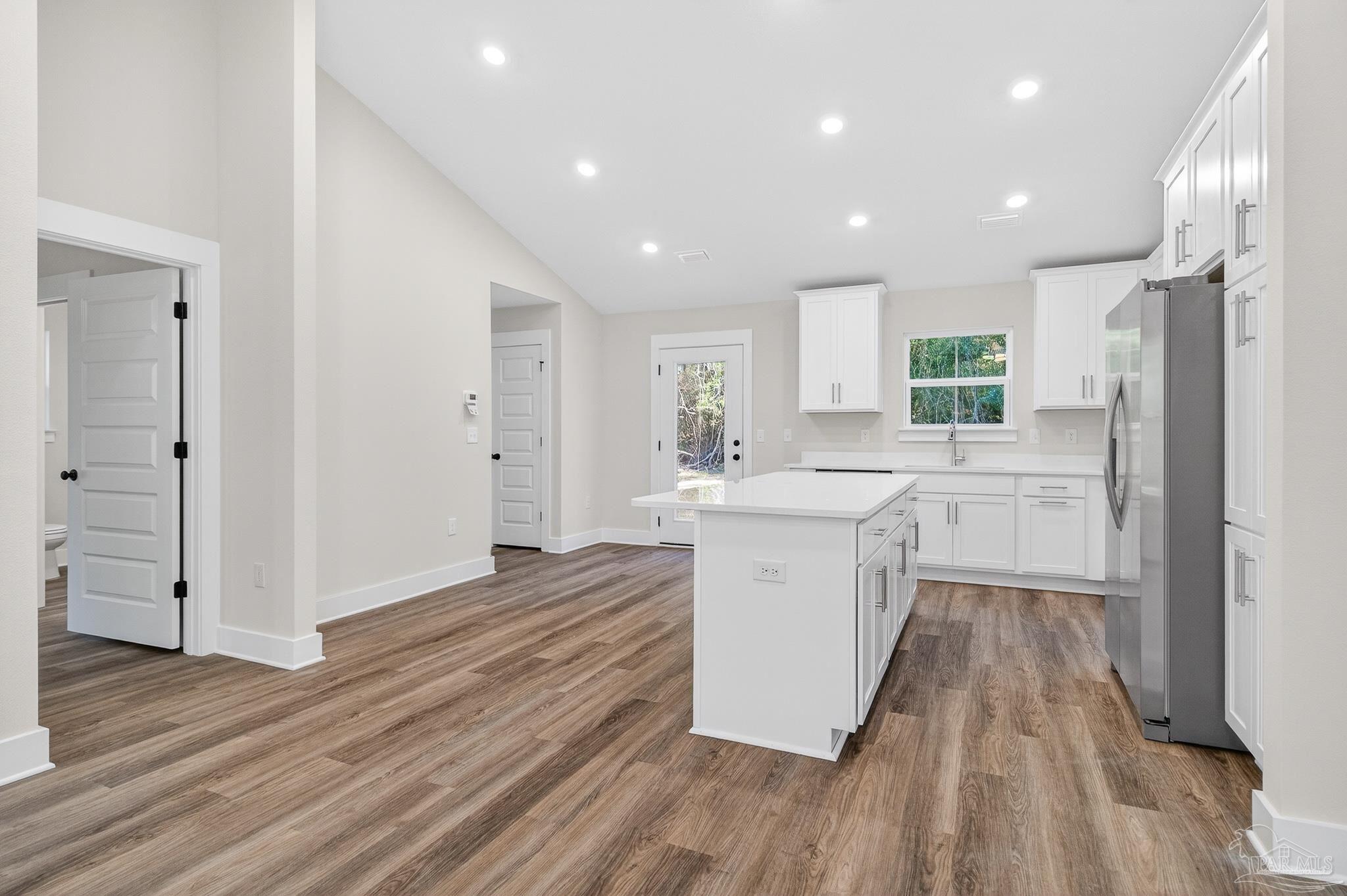 1056 Barth Road Molino, FL 32577 - Photo 3 of 46 a large kitchen with a sink and a refrigerator