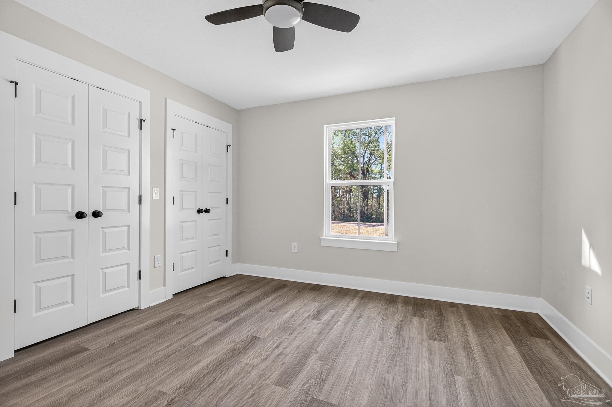 1056 Barth Road Molino, FL 32577 - Photo 32 of 46 wooden floor in an empty room with a window