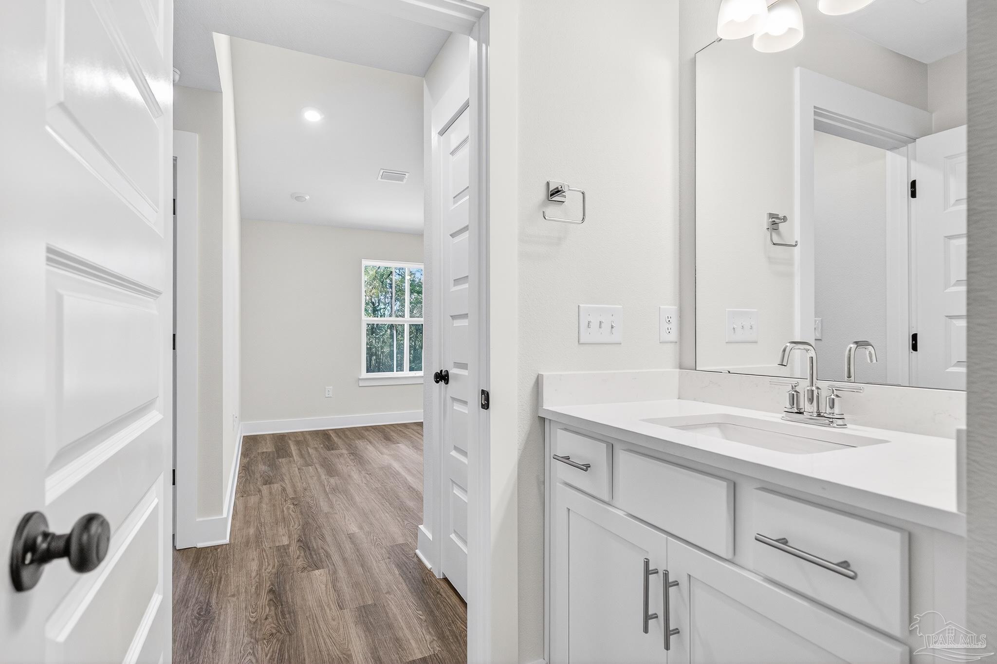 1056 Barth Road Molino, FL 32577 - Photo 34 of 46 a bathroom with a sink and a mirror