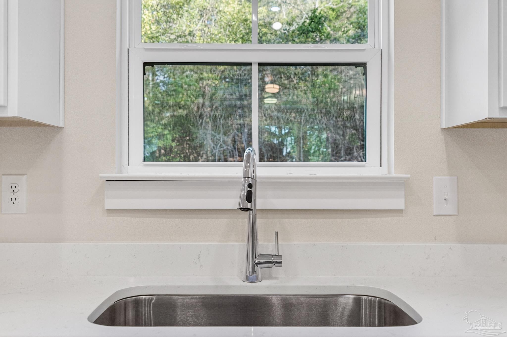 1056 Barth Road Molino, FL 32577 - Photo 41 of 46 a kitchen with a sink and large window