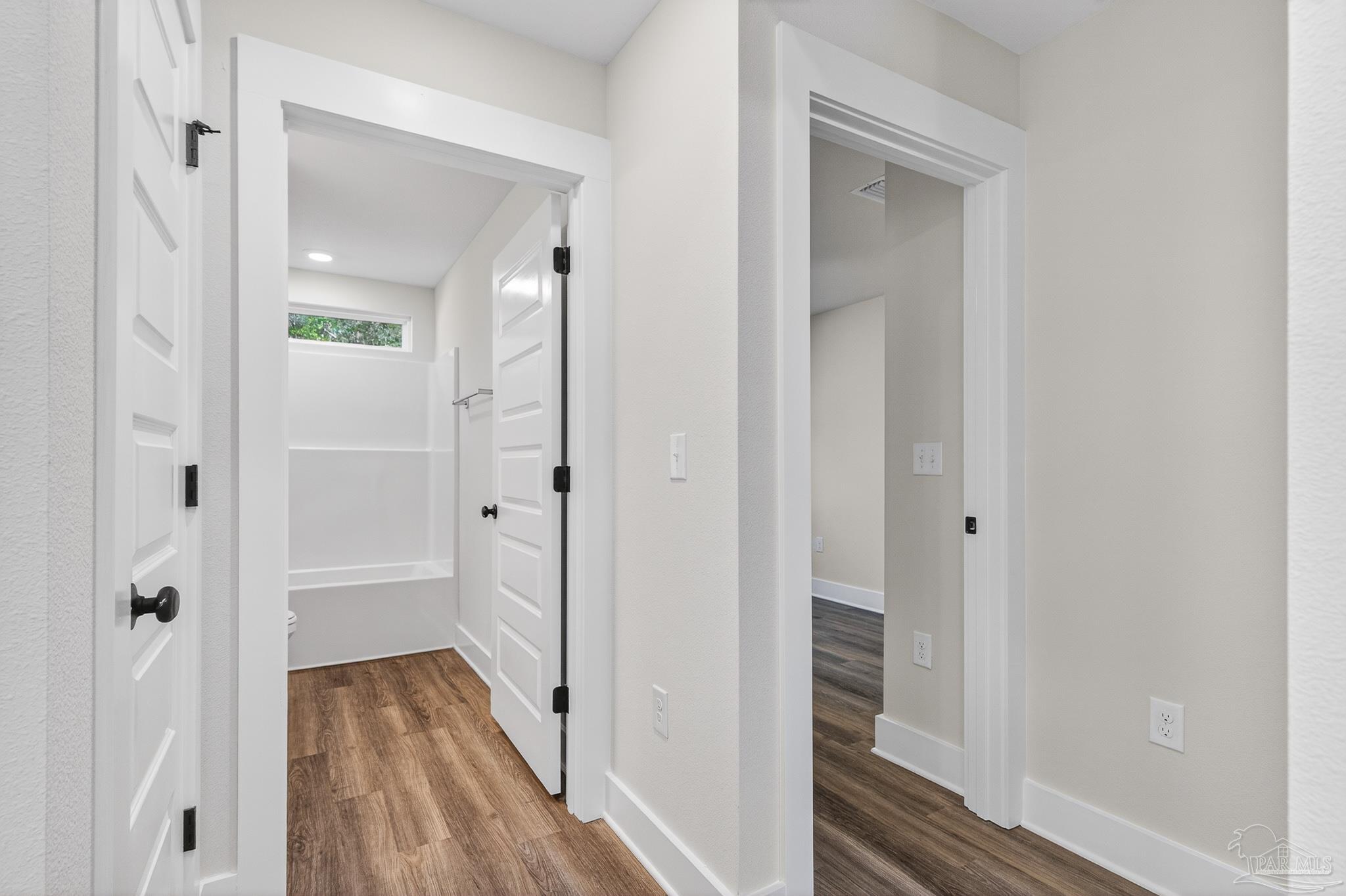 1056 Barth Road Molino, FL 32577 - Photo 45 of 46 a view of a hallway with wooden floor and closet area