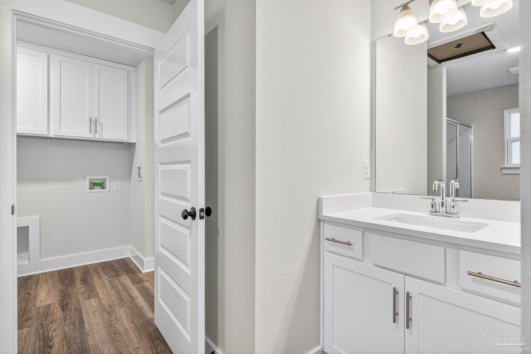 1056 Barth Road Molino, FL 32577 - Photo 46 of 46 a bathroom with a sink a mirror and a shower