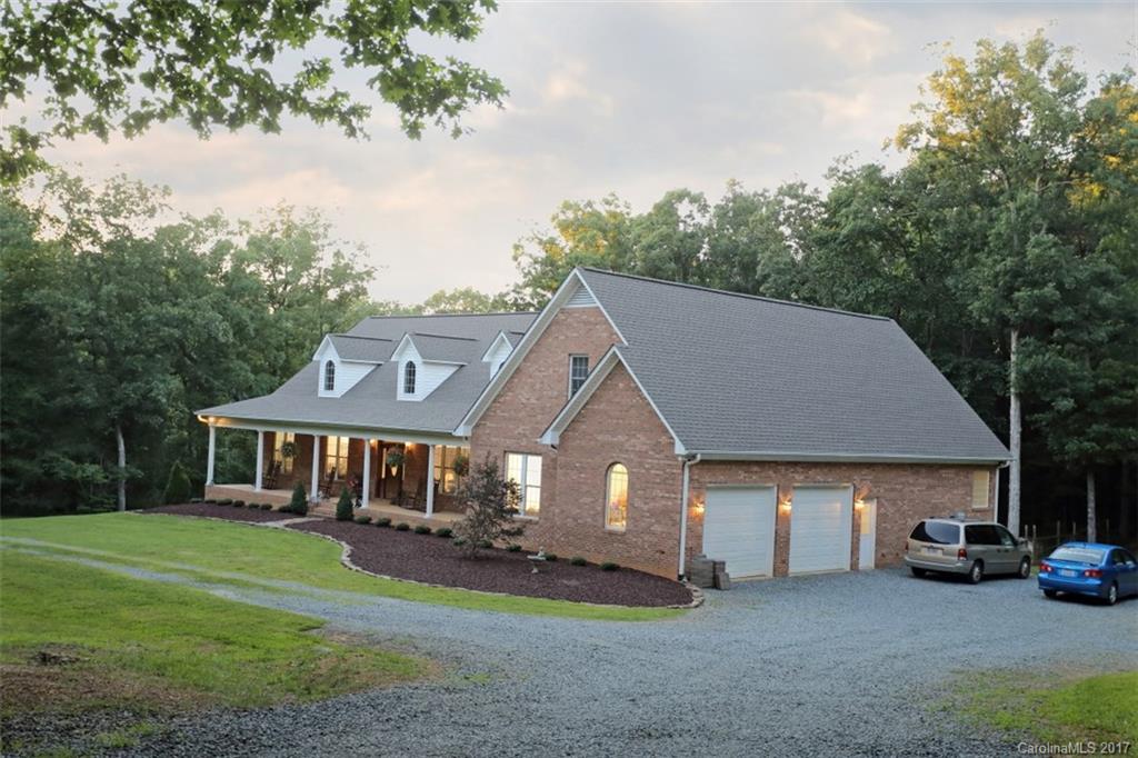 9805 Vineyard Road Mount Pleasant, NC 28124 - Photo 2 of 24 a aerial view of a house with a garden and pathway
