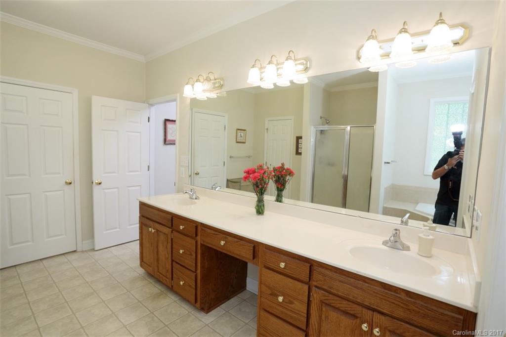 9805 Vineyard Road Mount Pleasant, NC 28124 - Photo 11 of 24 a spacious bathroom with a double vanity sink mirror and double