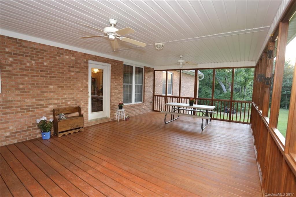 9805 Vineyard Road Mount Pleasant, NC 28124 - Photo 21 of 24 a living room with furniture and a floor to ceiling window