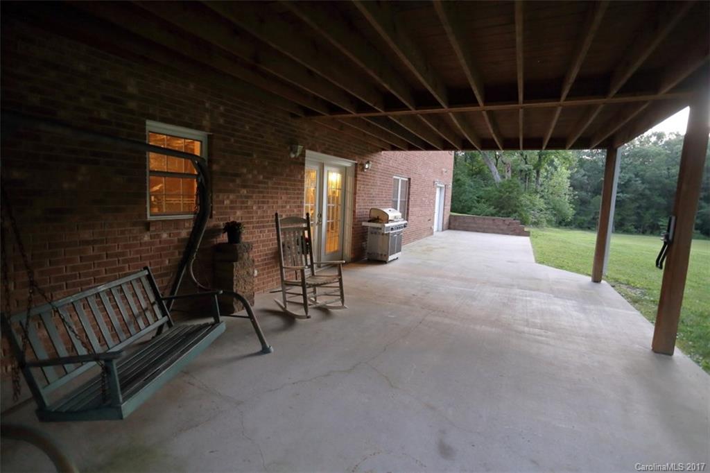 9805 Vineyard Road Mount Pleasant, NC 28124 - Photo 23 of 24 a view of a porch with furniture and garden