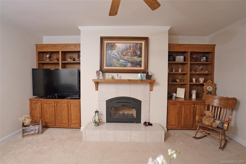 9805 Vineyard Road Mount Pleasant, NC 28124 - Photo 5 of 24 a living room with furniture and a flat screen tv