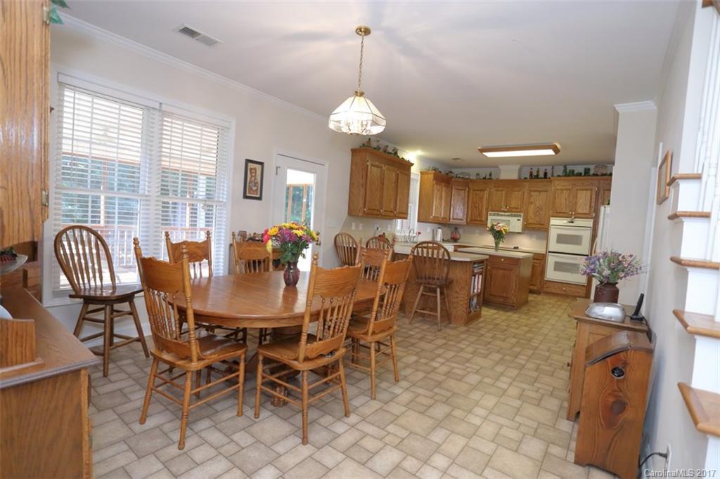 9805 Vineyard Road Mount Pleasant, NC 28124 - Photo 6 of 24 a view of a dining room with furniture window and outside view