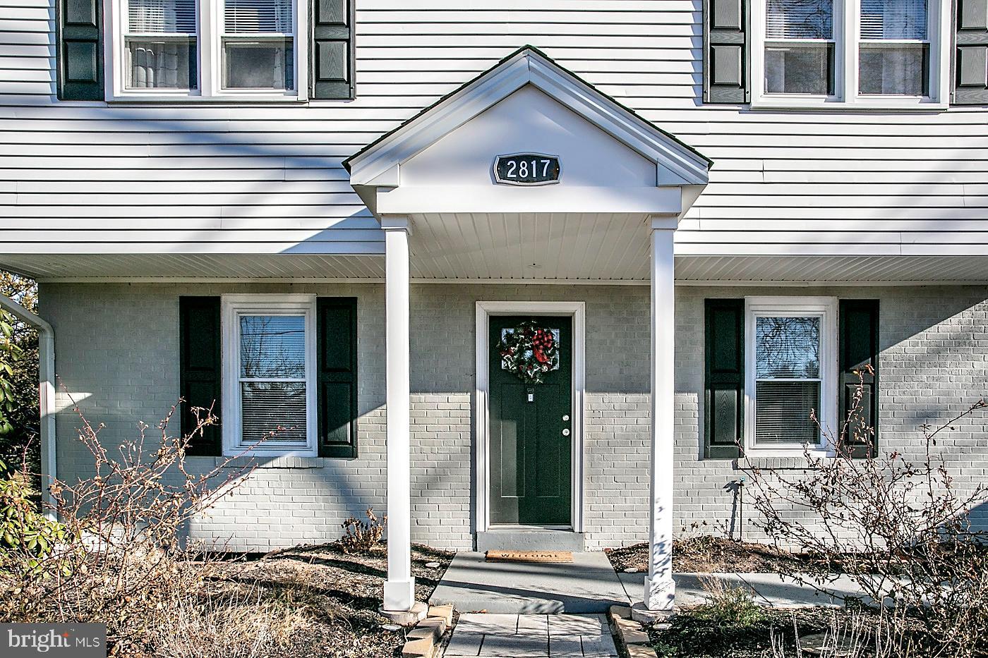 2817 Egypt Road Audubon, PA 19403 - Photo 4 of 25 a view of a white house with large windows and wooden fence