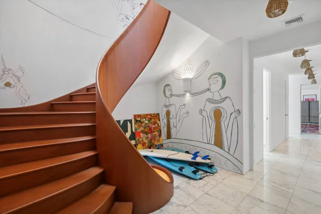 a view of a lake with houses in the back