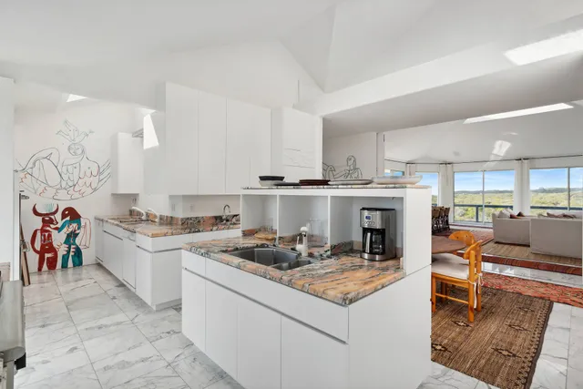 a kitchen with a stove and cabinets