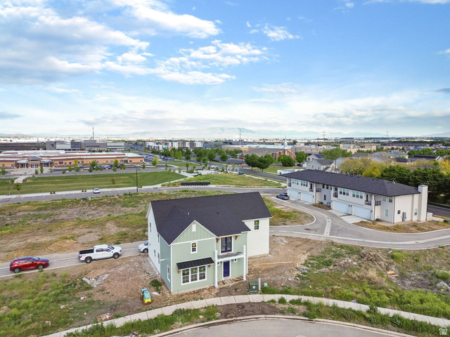 720 South Harrison Drive Springville, UT 84663 - Photo 5 of 14 Newly constructed two-story residence featuring light green siding and a dark roof