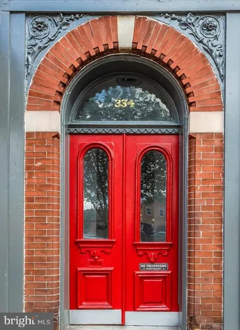 a view of building with red door and door