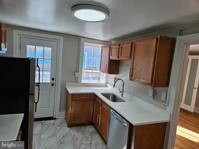 a kitchen with a refrigerator stove and microwave