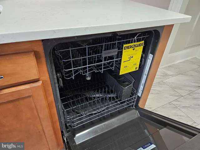 a stove top oven sitting inside of a kitchen