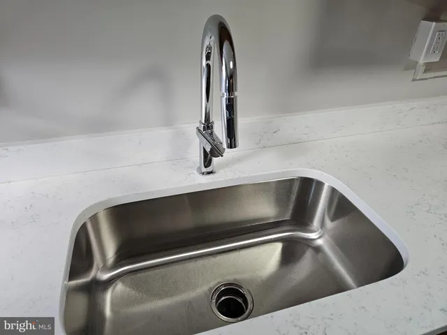 a close view of sink and washing machine