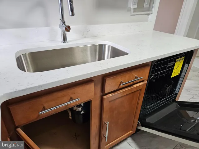 a view of a kitchen from stairs