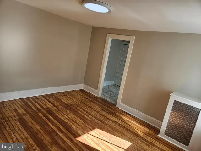 a kitchen with stainless steel appliances granite countertop a sink a microwave dishwasher and cabinets with wooden floor