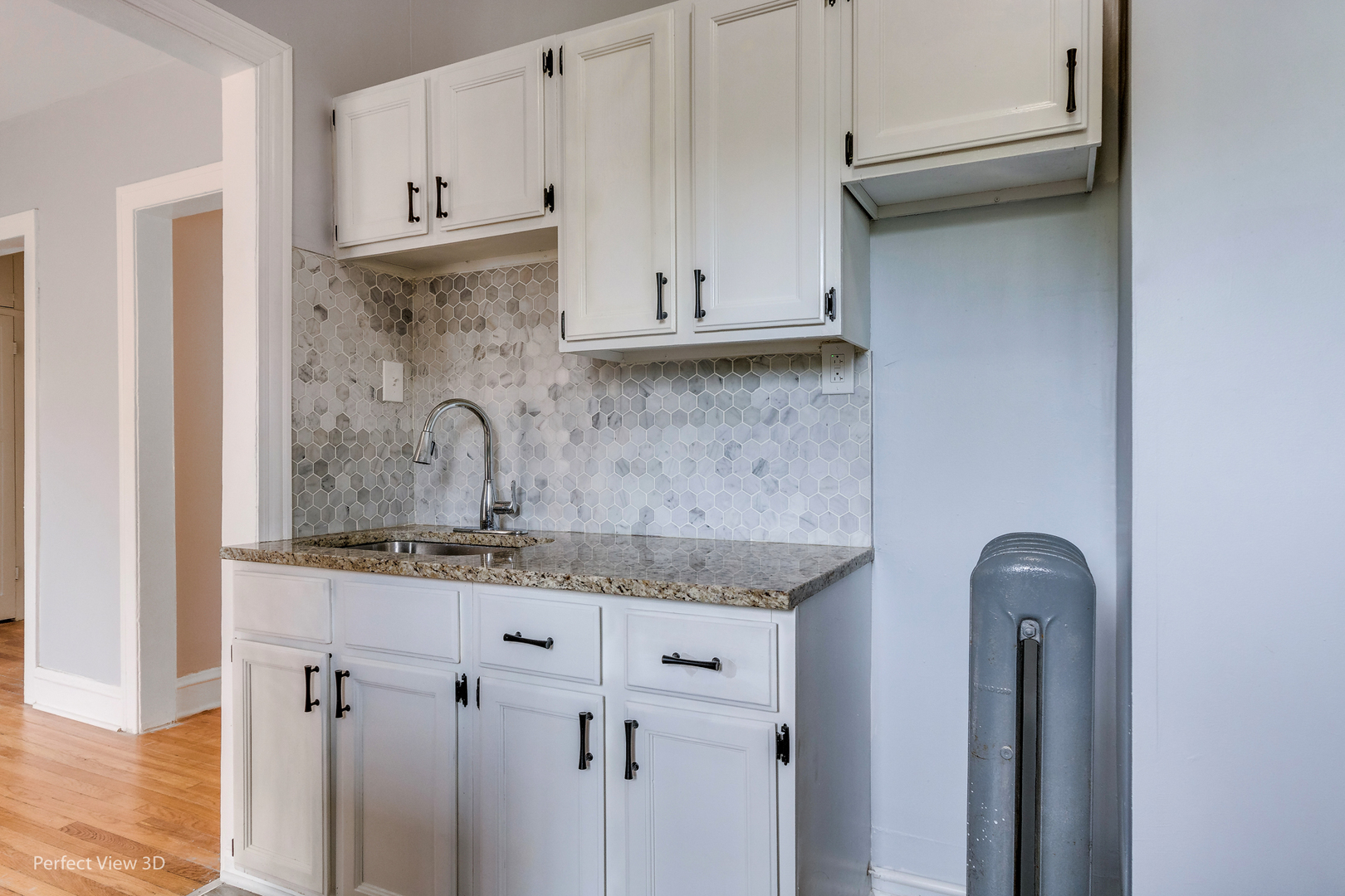 2212 East 70th Street, Unit 3D Chicago, IL 60649 - Photo 14 of 21 a kitchen with a sink and cabinets