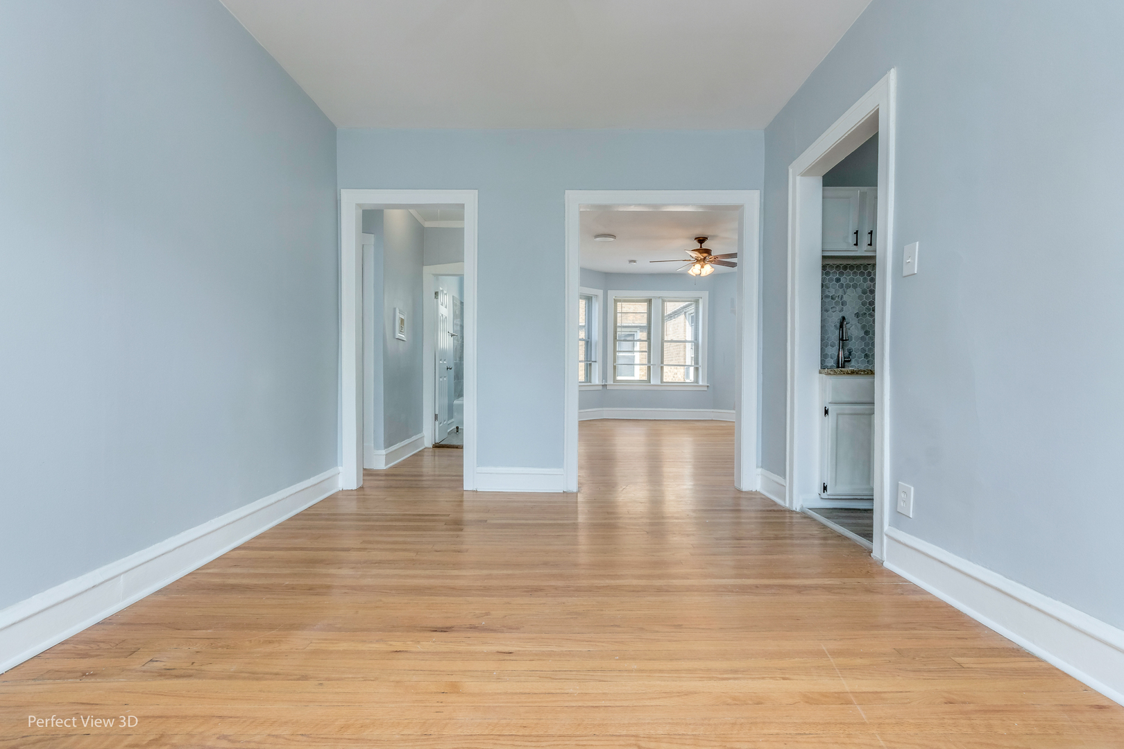 2212 East 70th Street, Unit 3D Chicago, IL 60649 - Photo 16 of 21 a view of an empty room with wooden floor and a window