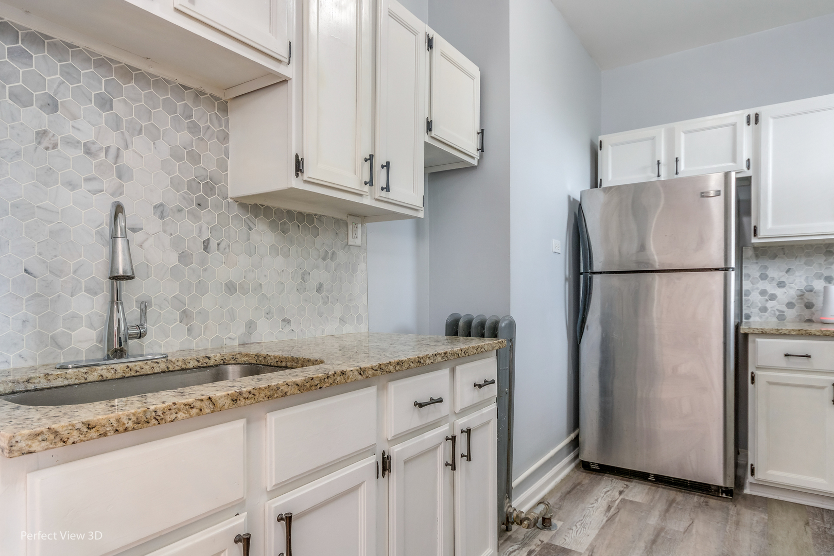 2212 East 70th Street, Unit 3D Chicago, IL 60649 - Photo 10 of 21 a kitchen with stainless steel appliances granite countertop a refrigerator and a stove