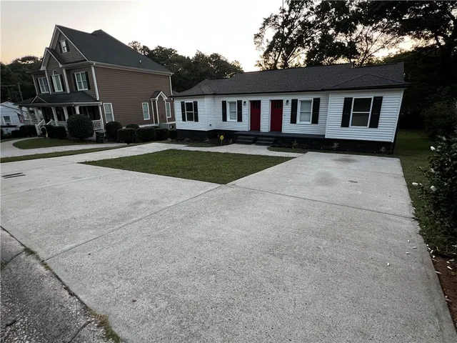 a view of house with outdoor space and porch