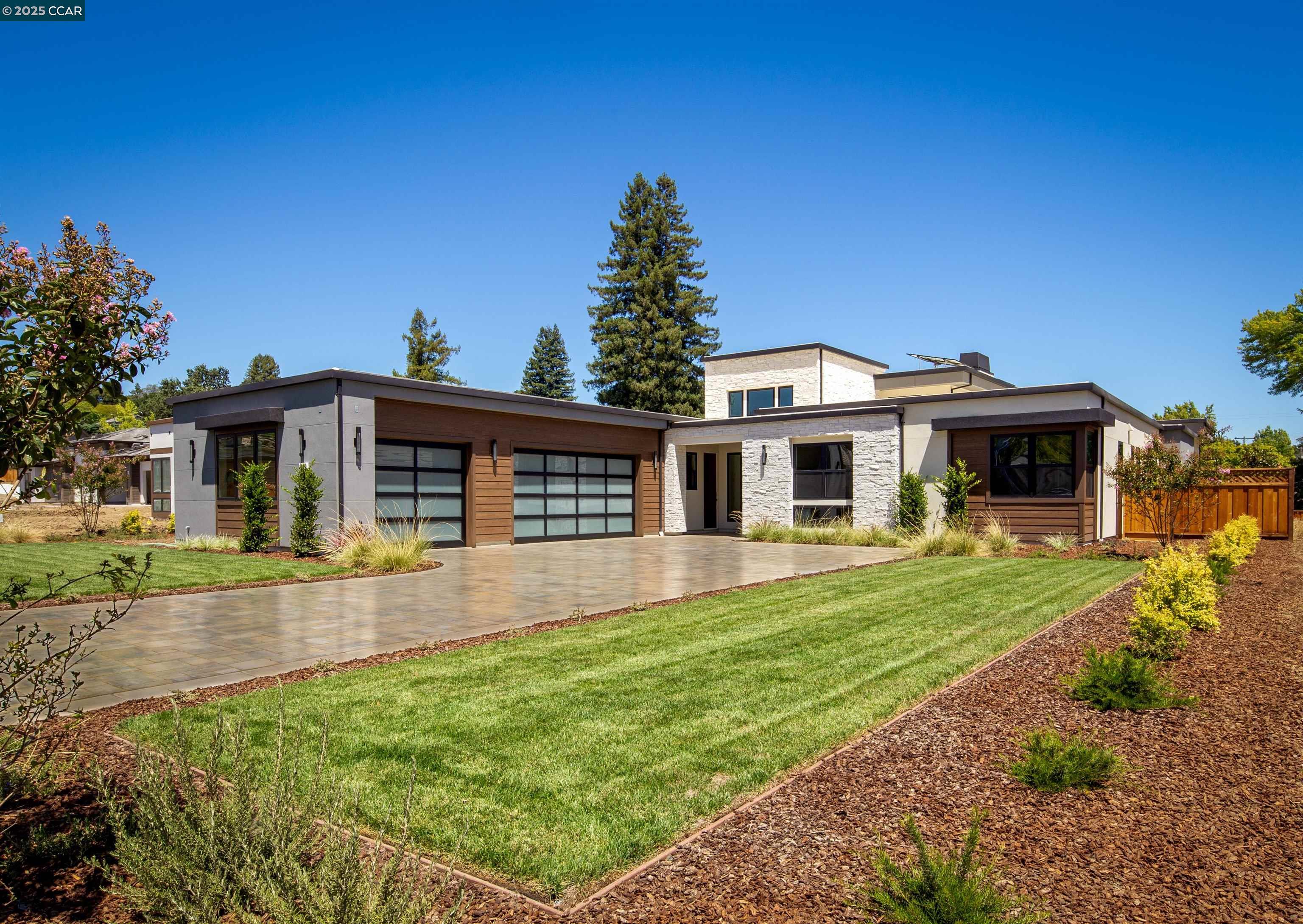 1070 Borrette Lane Napa, CA 94558 - Photo 2 of 28 a front view of a house with a garden and yard