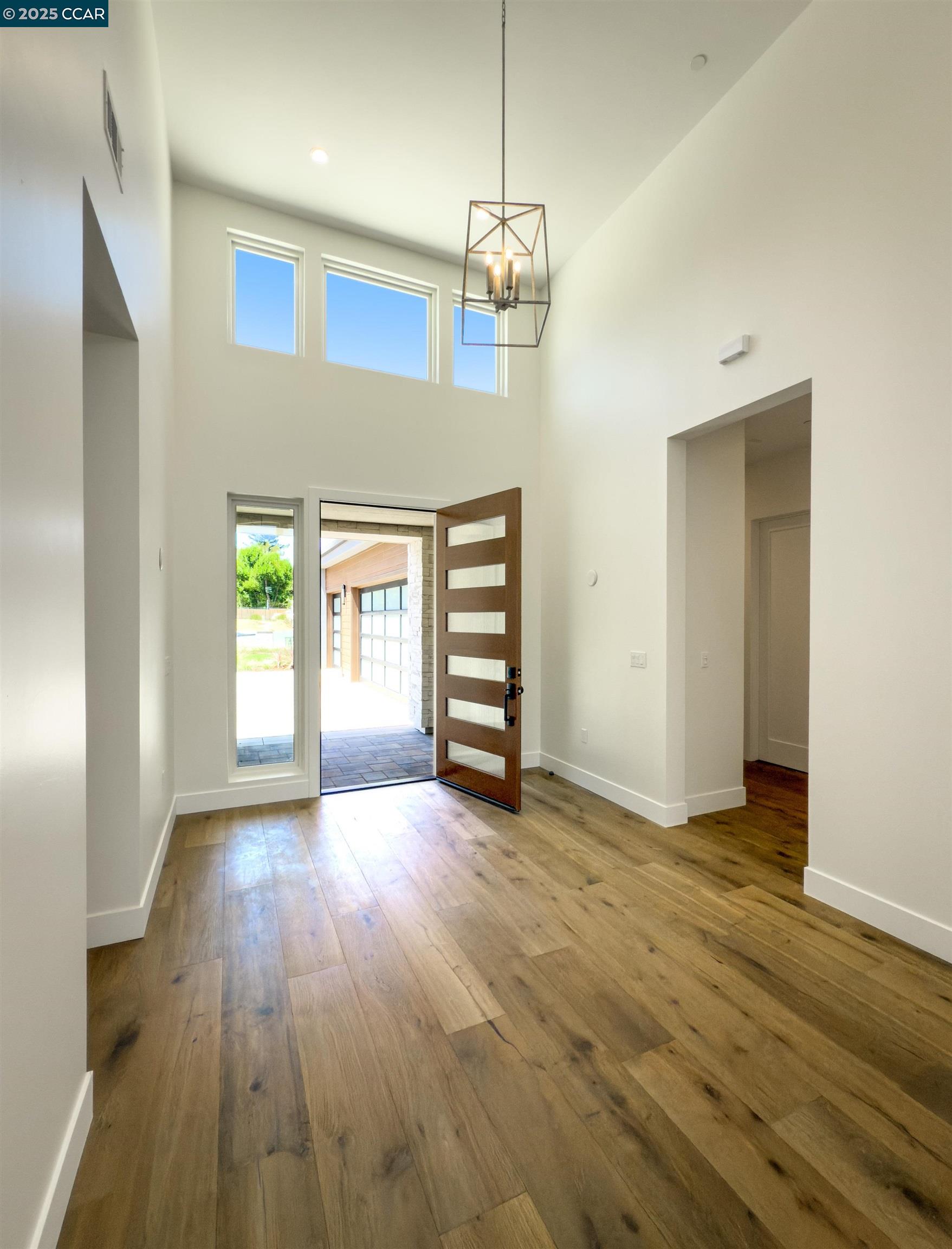 1070 Borrette Lane Napa, CA 94558 - Photo 3 of 28 a view of an empty room with wooden floor and a window
