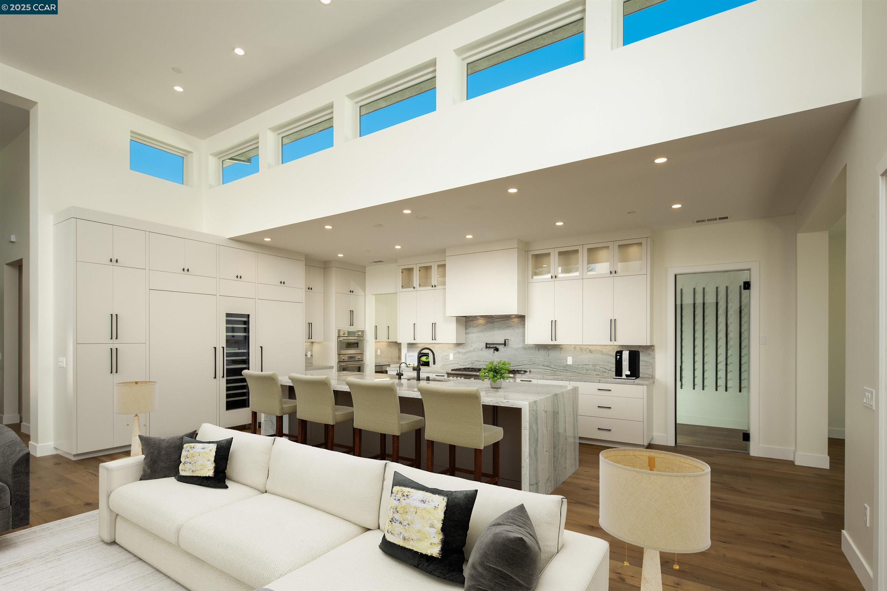 1070 Borrette Lane Napa, CA 94558 - Photo 5 of 28 a living room with stainless steel appliances kitchen island granite countertop a couch and cabinets