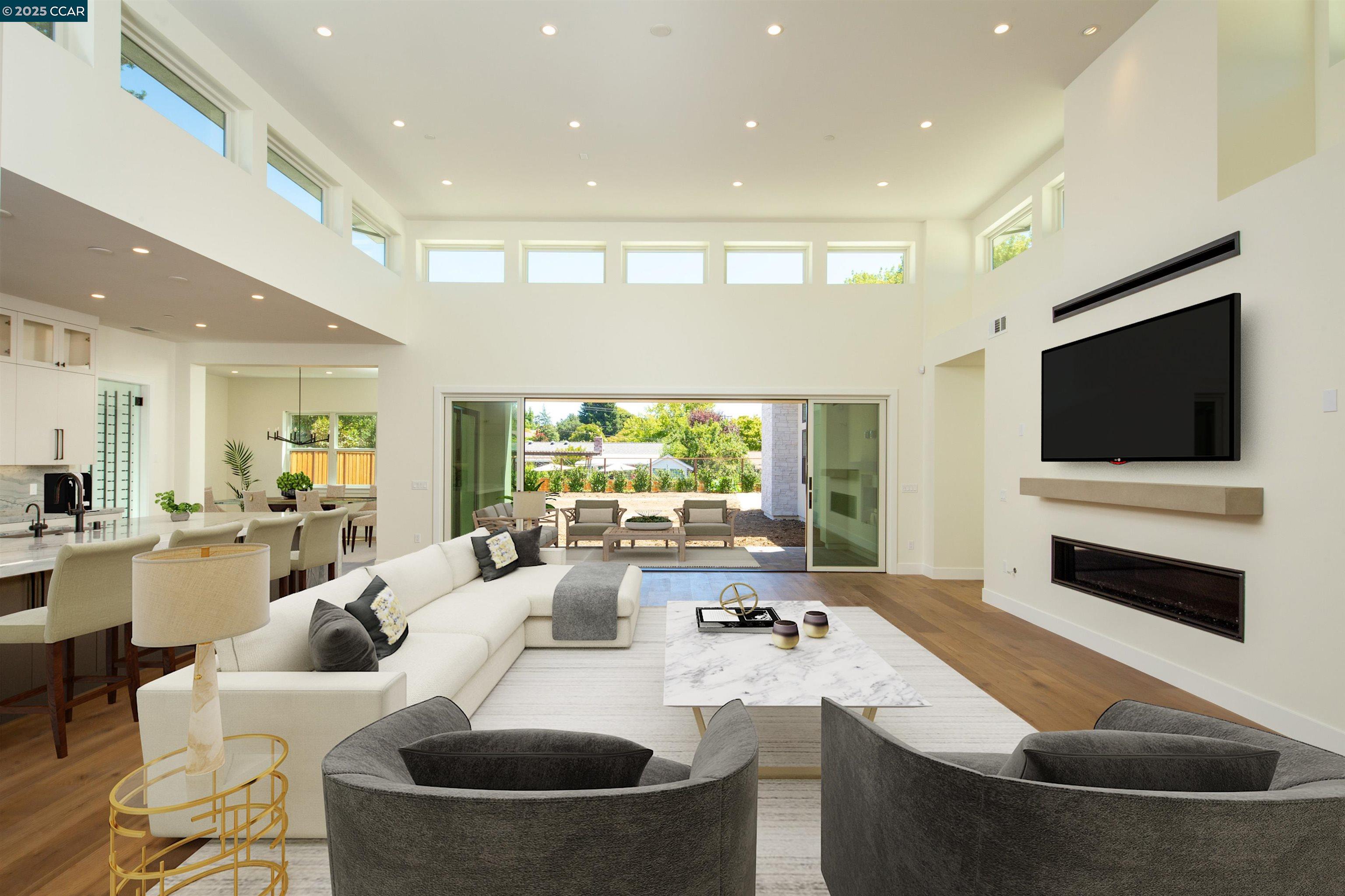 1070 Borrette Lane Napa, CA 94558 - Photo 8 of 28 a living room with a large window and a flat screen tv