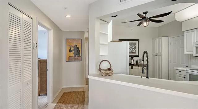 a very nice looking room with a ceiling fan