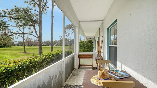 a room with furniture and a large window