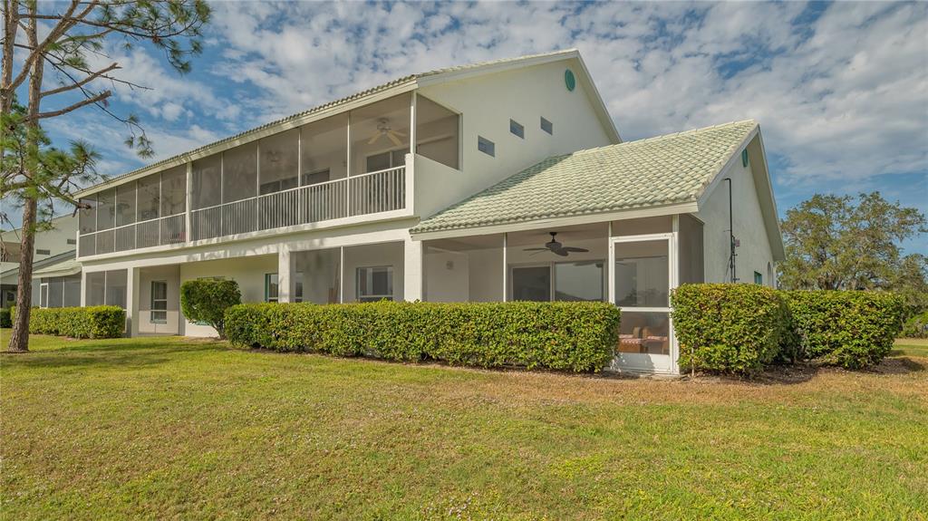 6556 Fairway Gardens Drive Bradenton, FL 34203 - Photo 25 of 43 a front view of a house with a yard