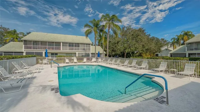 a view of a swimming pool with a patio