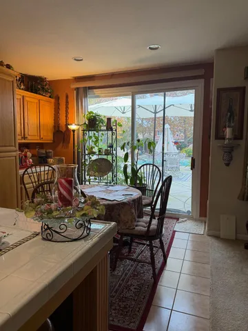 a view of a dining room with furniture window and outside view