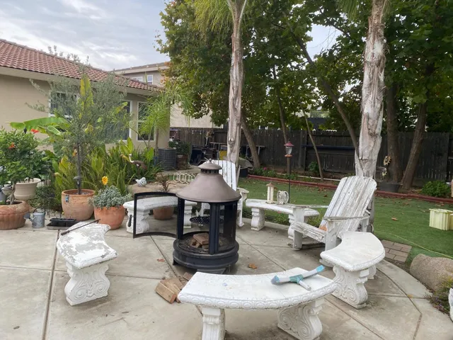 a view of a patio with a chairs and table in a patio