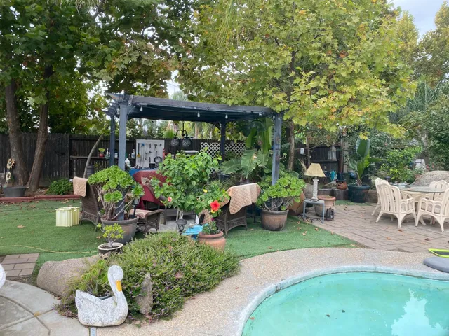 a backyard of a house with lots of green space