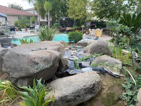 a view of a backyard both side of the house