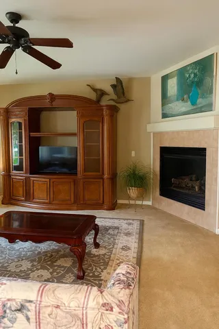 a bedroom with a bed and a fireplace