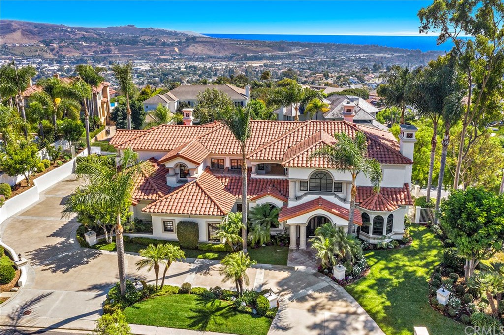 Mediterranean Estate Open light and bright with Ocean views in the 24 hour guard gated community of Bear Brand Ranch!