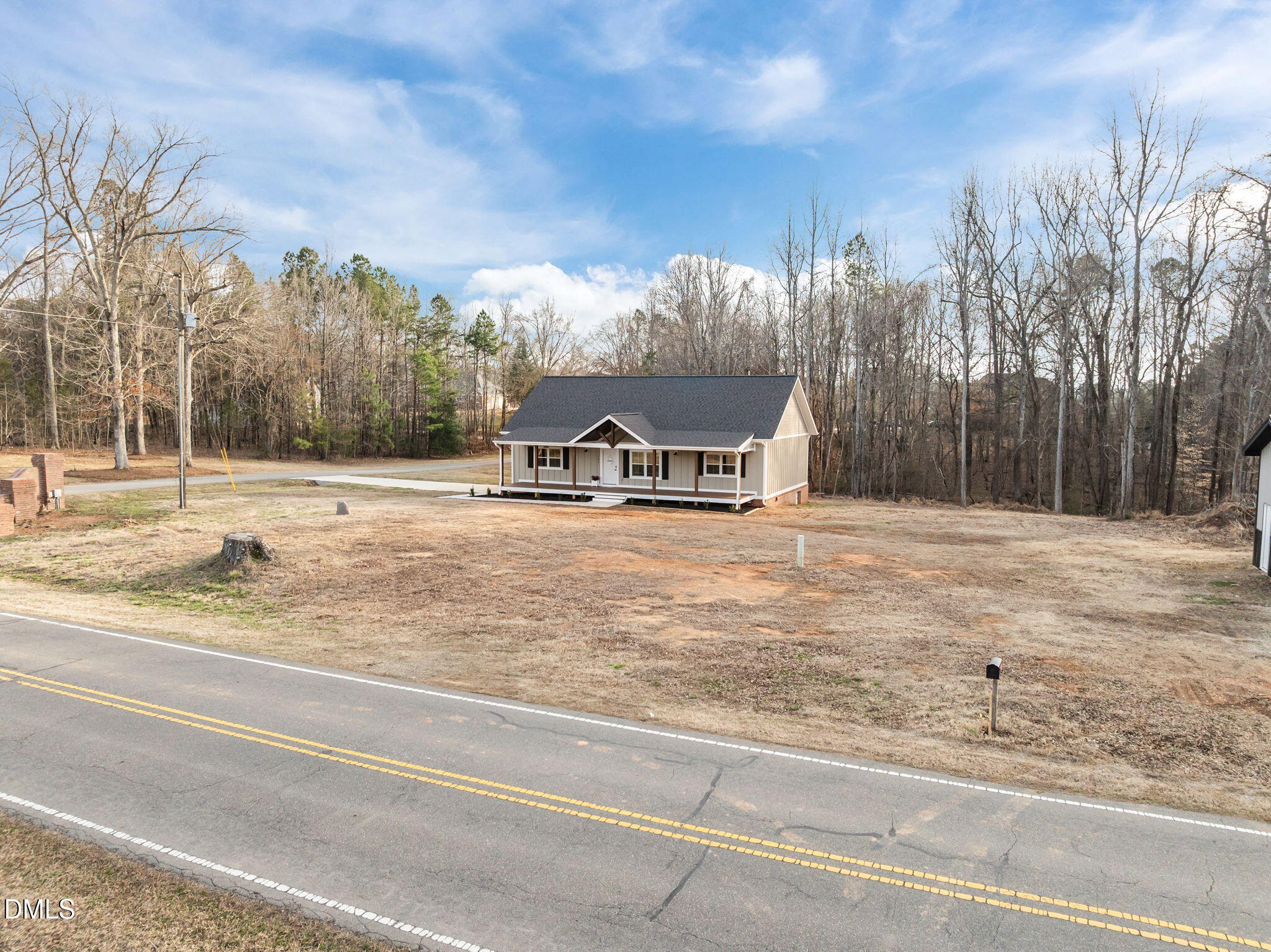 193 Community House Road, Unit A47 266 Roxboro, NC 27574 - Photo 12 of 55 a view of a house with a yard